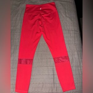Zyia sunset color (orange/pink mix) leggings with mesh and perforated cutouts